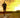 Man running on a road into the sunset