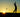 The contours of a person swinging a golf club in the sunset