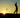 The contours of a person swinging a golf club in the sunset