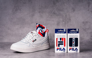 White FILA sneaker with SmellWell Active insert and two packages of SmellWell & FILA Collab Inserts