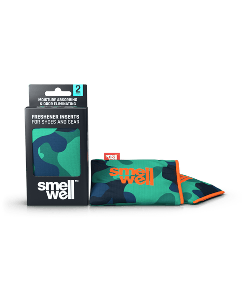 A package of SmellWell Active - Camo Green and 2 SmellWell Active - Camo Green freshener inserts bags next to it