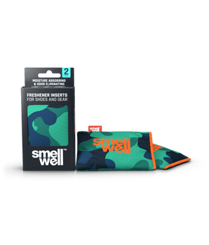 A package of SmellWell Active - Camo Green and 2 SmellWell Active - Camo Green freshener inserts bags next to it