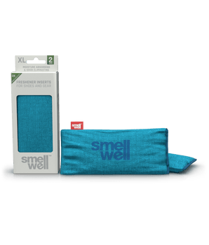 A package of SmellWell Sensitive XL - Blue and 2 SmellWell Sensitive XL - Blue freshener inserts bags next to it