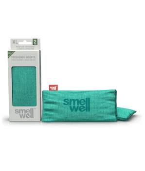 A package of SmellWell Sensitive XL - Green and 2 SmellWell Sensitive XL - Green freshener inserts bags next to it